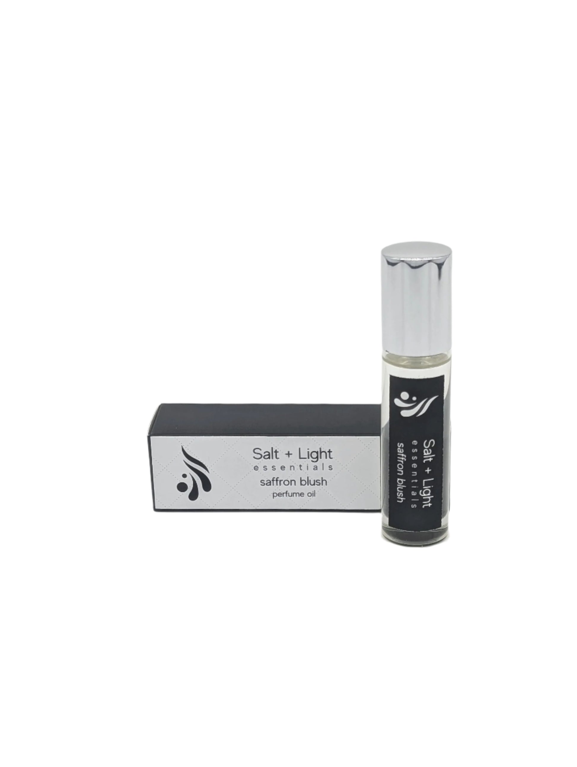 Saffron Blush perfume oil in a roller bottle next to it's box